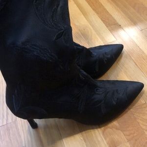 Black knee high heeled boots